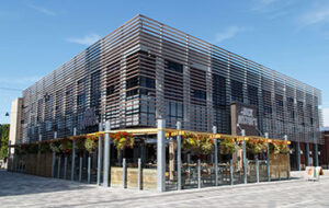 Image of the front of Jack Astor's restaurant with the patio at TD Place
