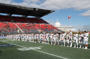 Carleton Ravens lined up for the national anthem at the 2017 Panda Game