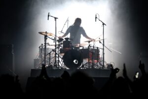 Image of a drummer performing on stage at TD Place