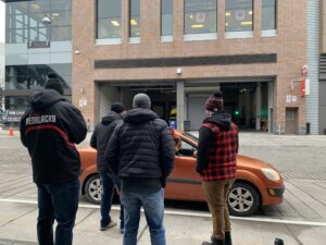 Image of 67's players and staff working at the holiday toy drive at TD Place